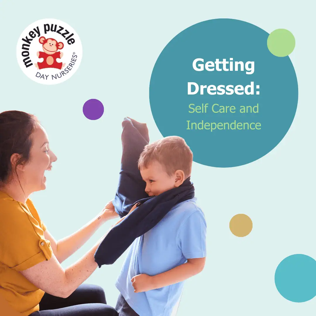Young child learning self dressing skills at Monkey Puzzle Kingston nursery.