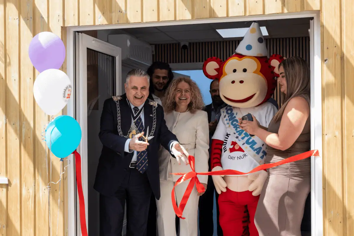 Grand opening of Monkey Puzzle Day Nursery Kingston with ribbon cutting ceremony.