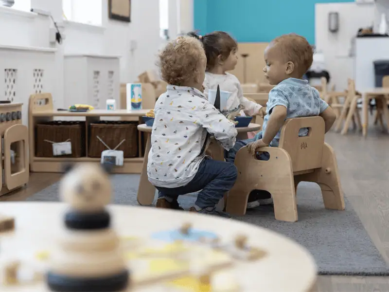 Monkey Puzzle Day Nursery Kingston Kids Playing Children playing with toys at Monkey Puzzle Day Nursery Kingston.